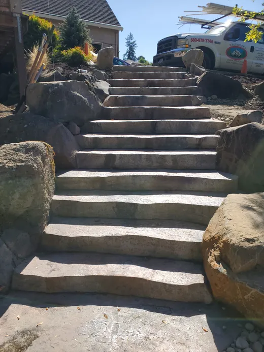 Stamped, stained, or hand-carved concrete work by Earthworks Landscape Service