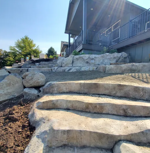 Stamped, stained, or hand-carved concrete work by Earthworks Landscape Service