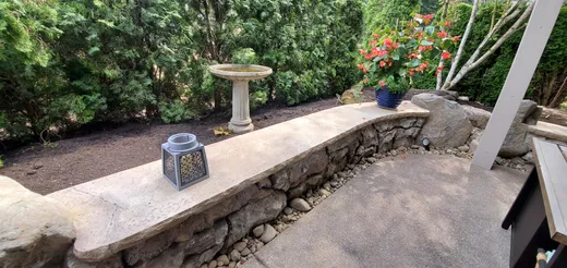 Stamped, stained, or hand-carved concrete work by Earthworks Landscape Service