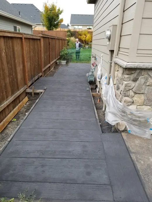 Stamped, stained, or hand-carved concrete work by Earthworks Landscape Service
