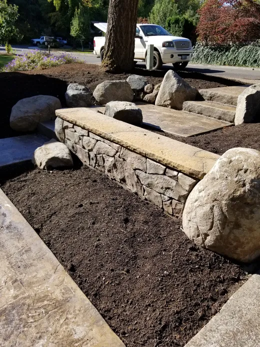 Stamped, stained, or hand-carved concrete work by Earthworks Landscape Service