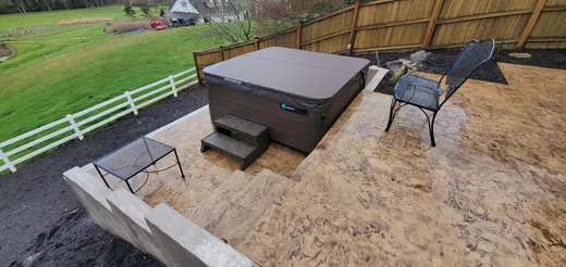 Stamped, stained, or hand-carved concrete work by Earthworks Landscape Service