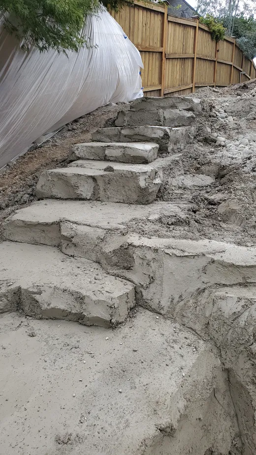 Stamped, stained, or hand-carved concrete work by Earthworks Landscape Service