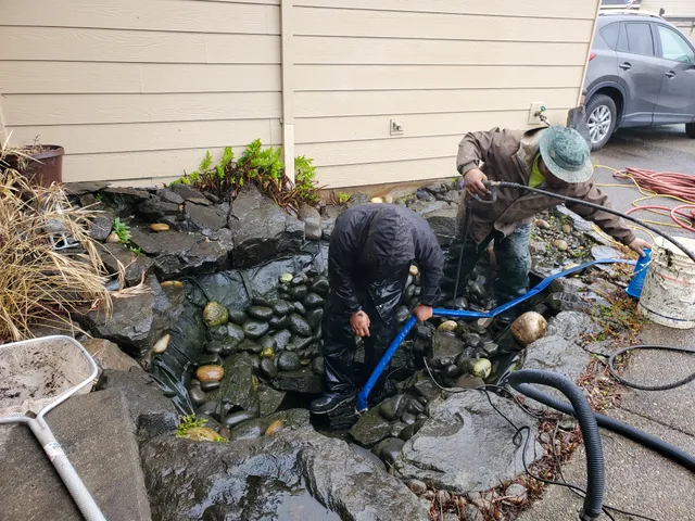 Earthworks crew servicing a pond during a seasonal cleanout
