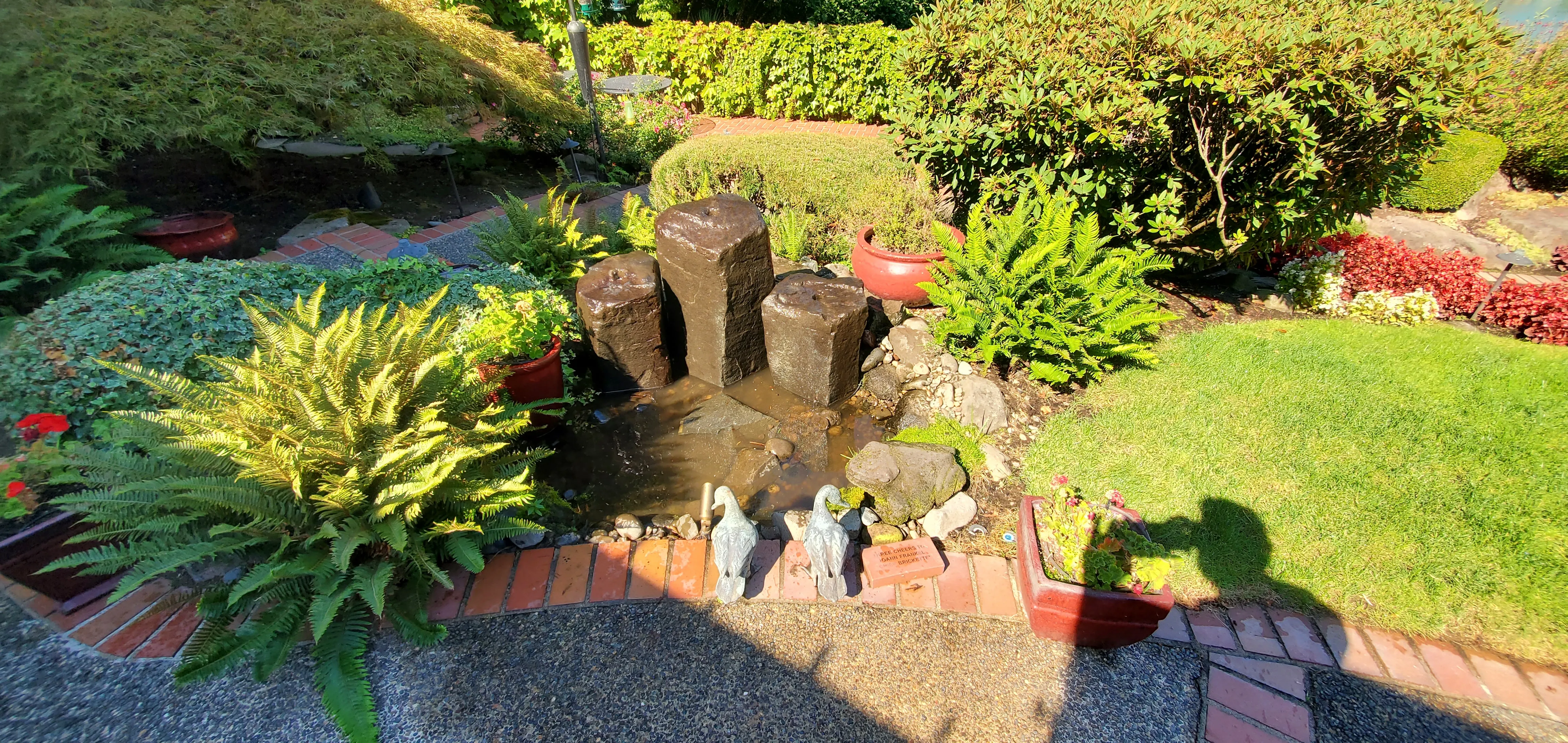 Basalt column bubbler fountain in a Lake Oswego entry garden